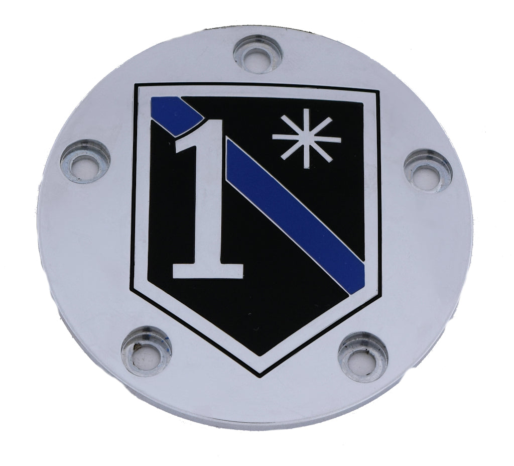 black shield with blue sash and the number one on a metal cover
